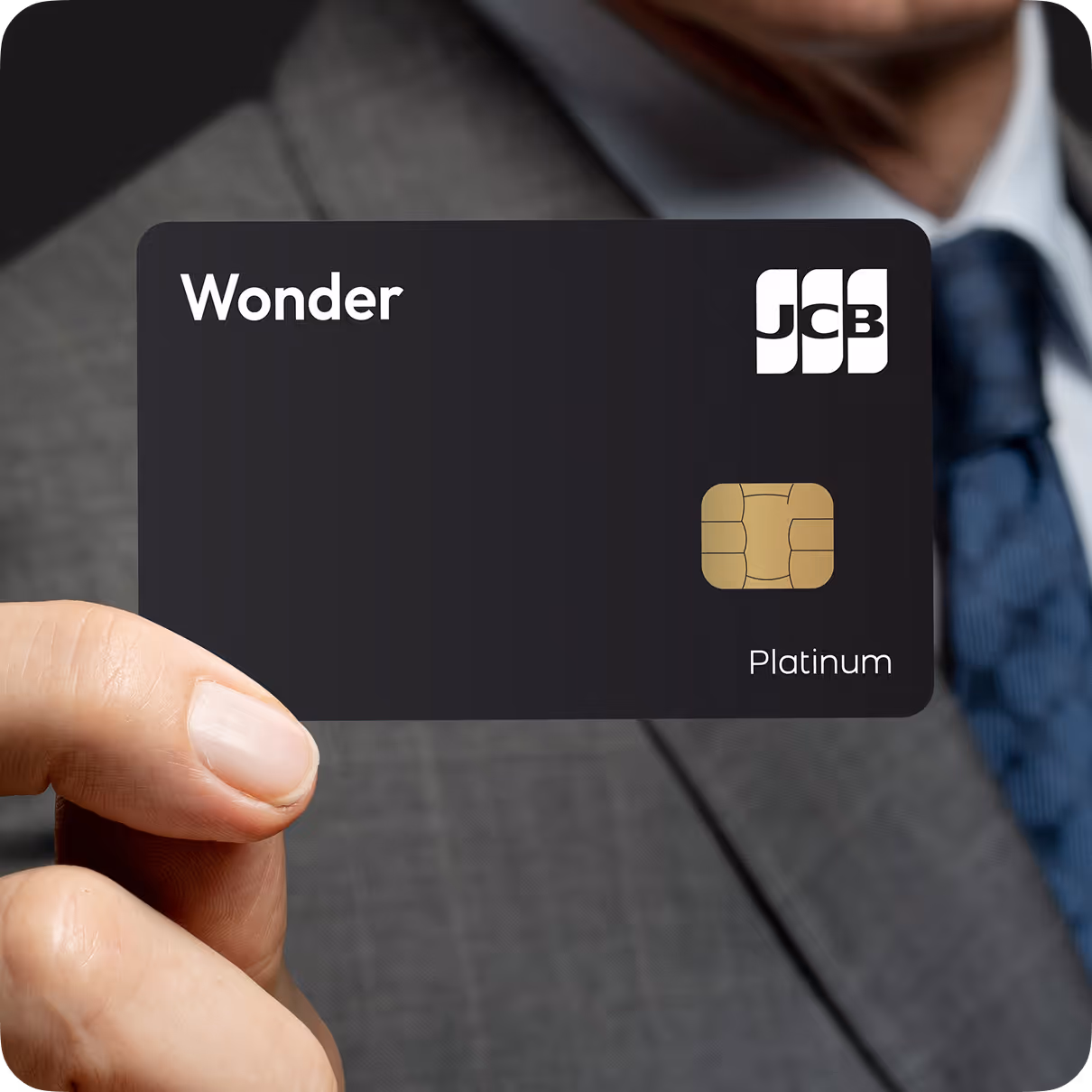 Wonder JCB Metal Card floating against a navy backdrop