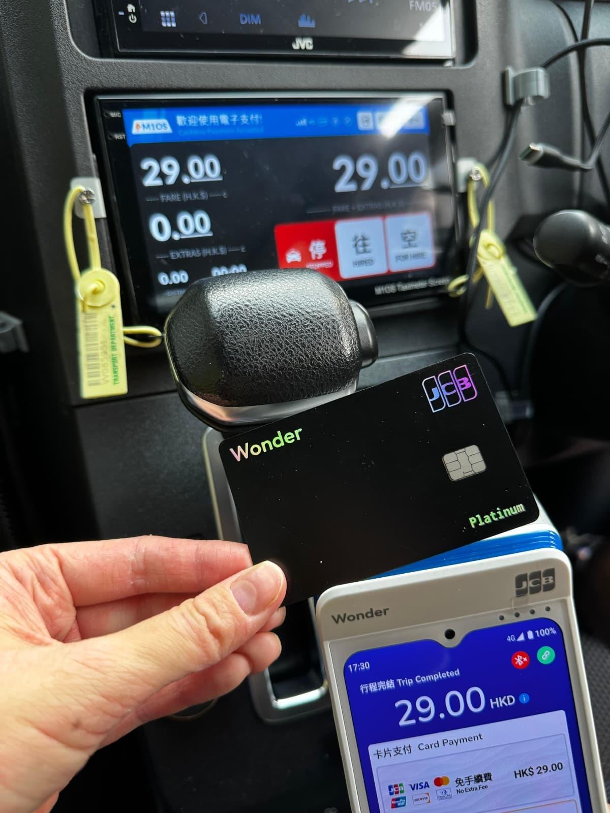 Passenger paying by JCB Card in a Hong Kong taxi